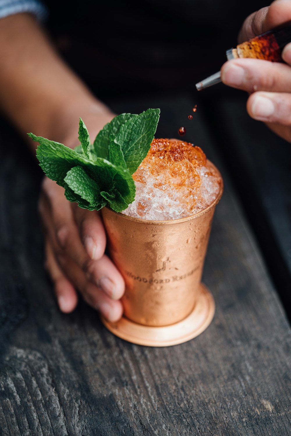 A cocktail being garnished at the bar