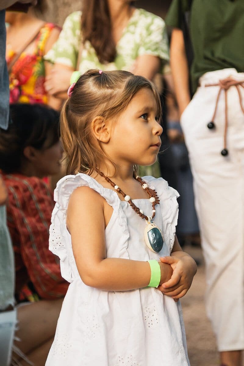 A young girl watching the show