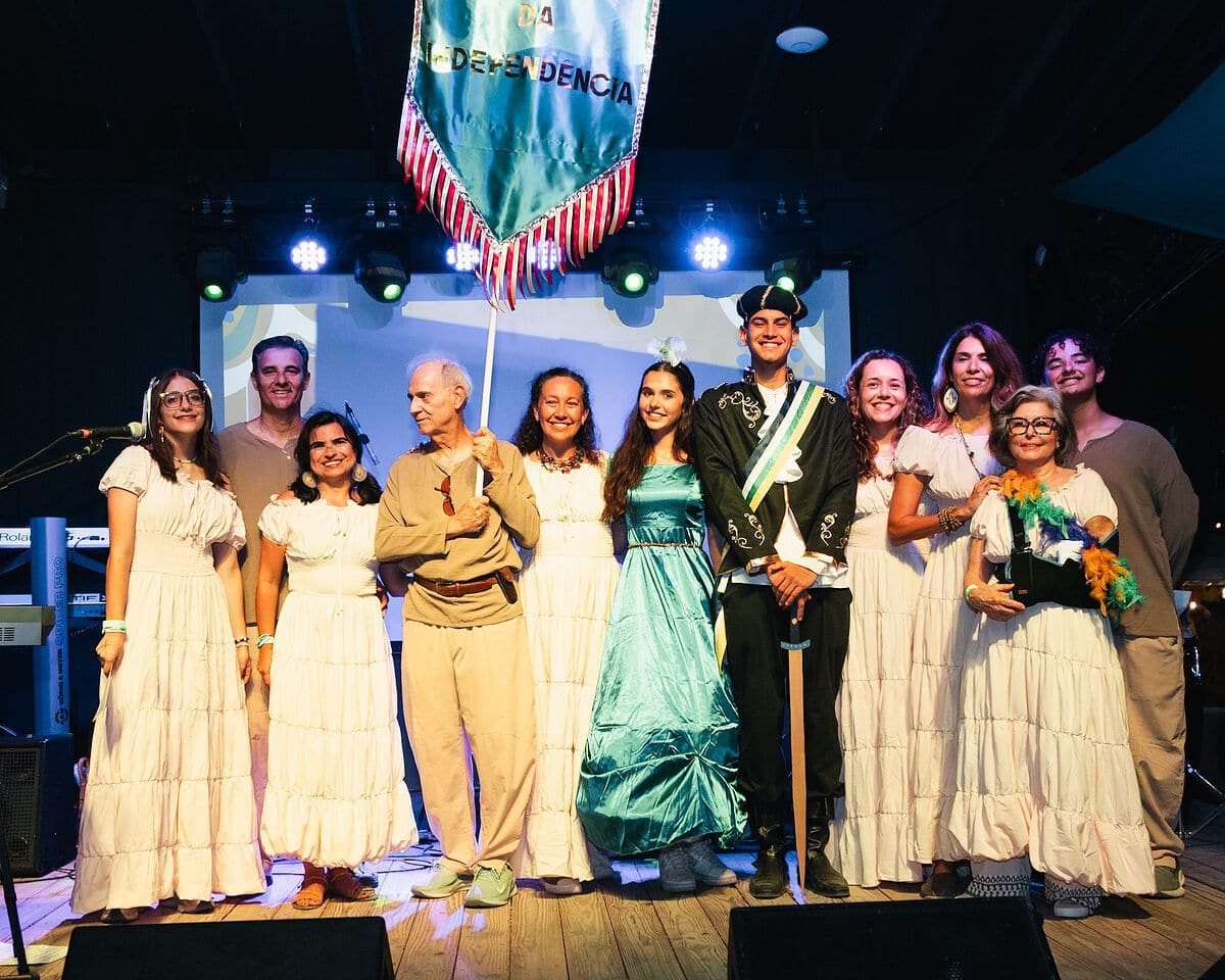 A folk group in traditional costume on stage