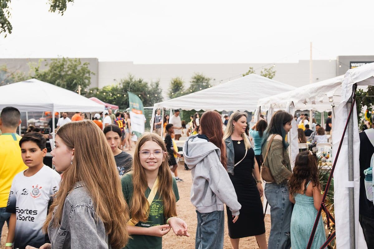 Visitors walking through the food and vendor marketplace