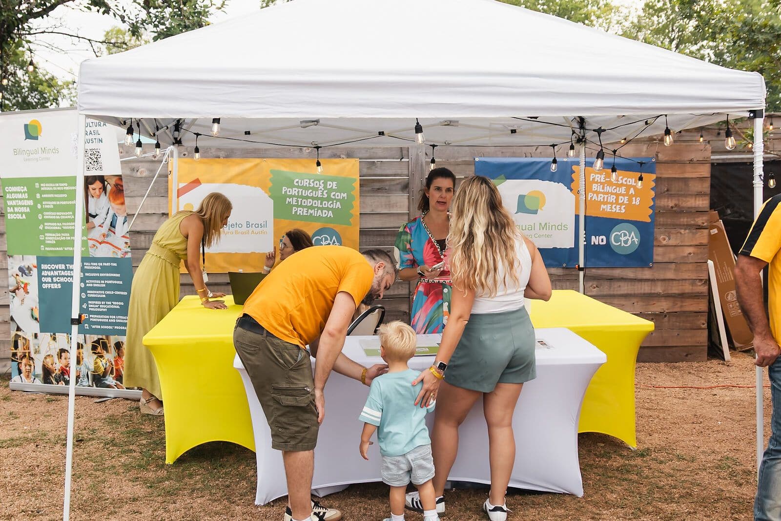 A sponsor booth welcoming families